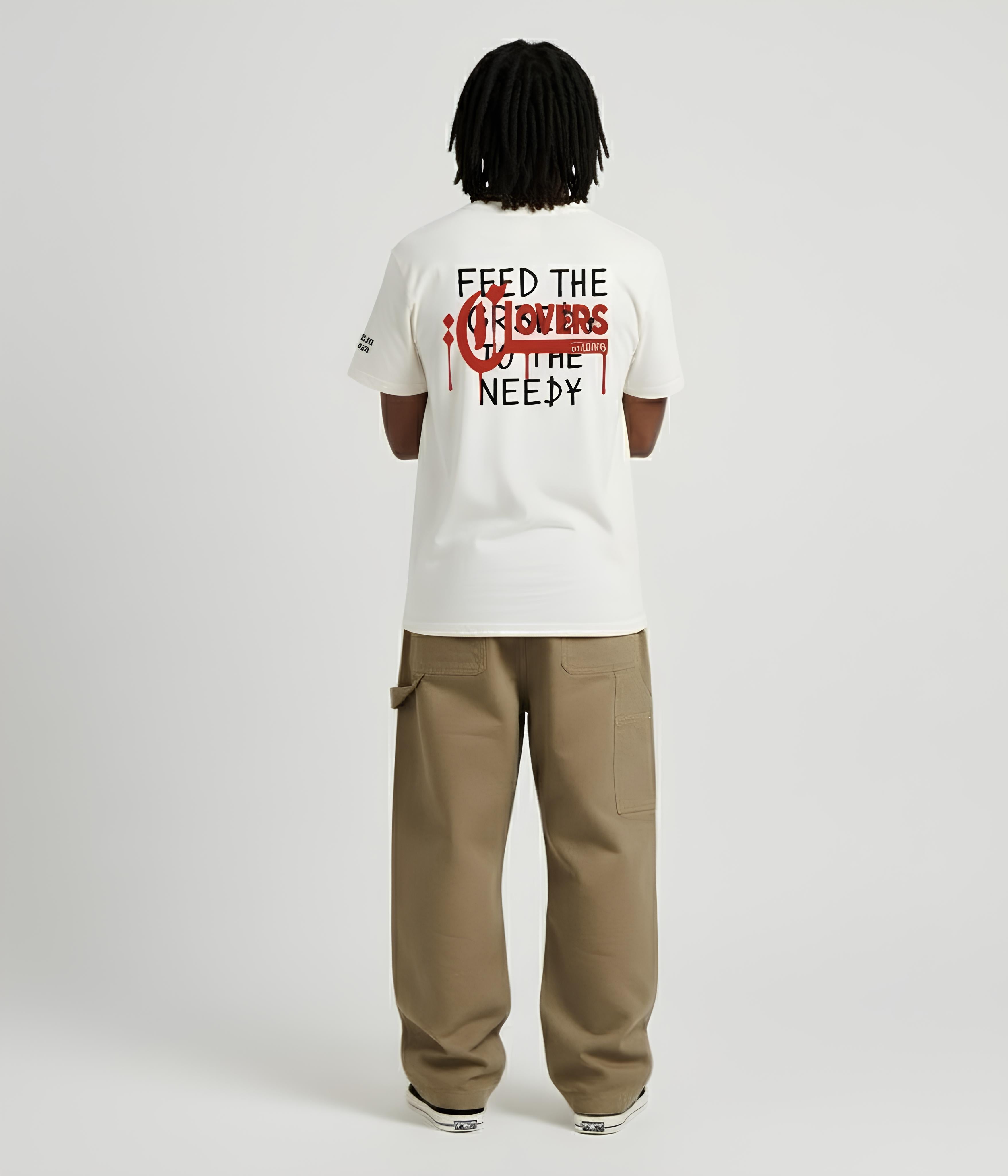 Person wearing a white t-shirt with text on the back, standing against a plain background